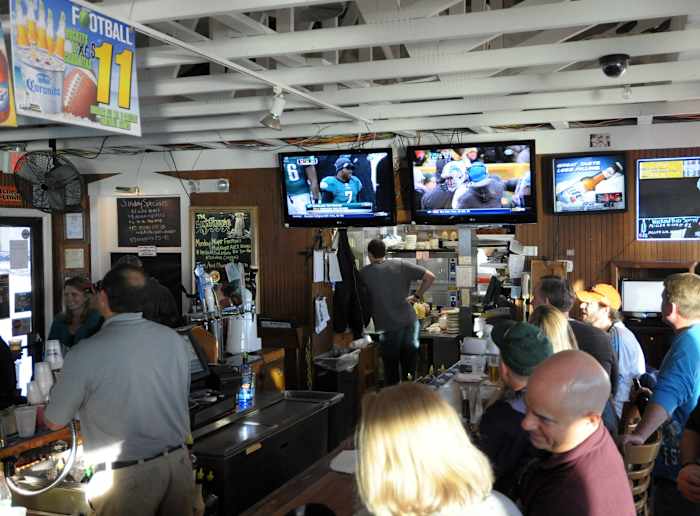 Football on TV at a bar